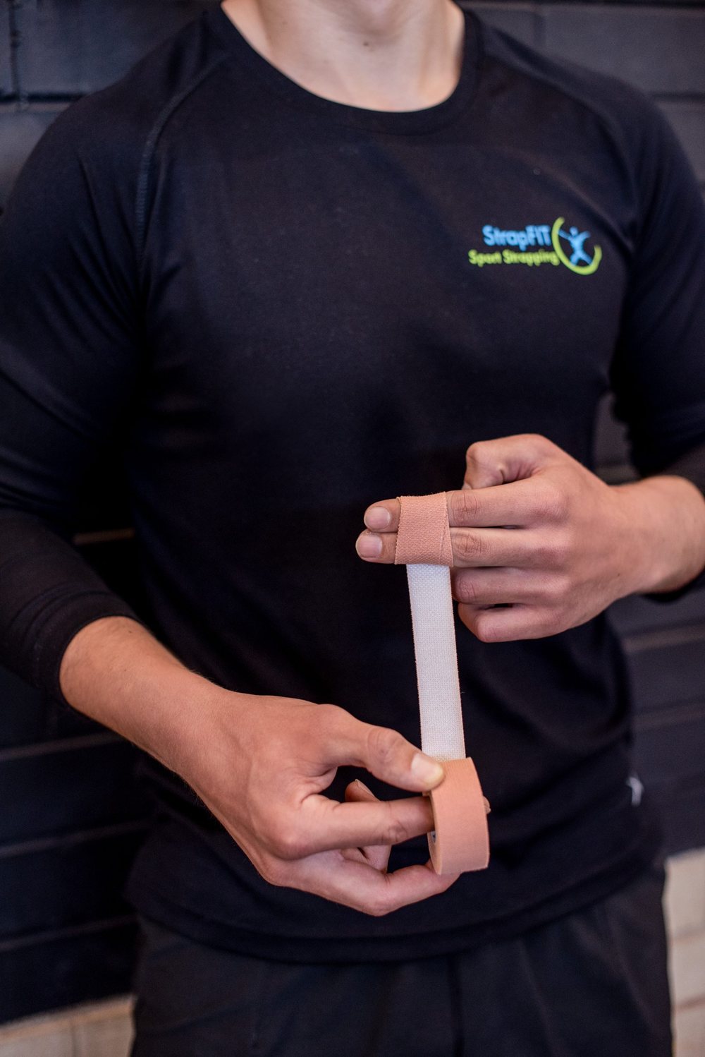 Sports tape applied around an athlete's wrist